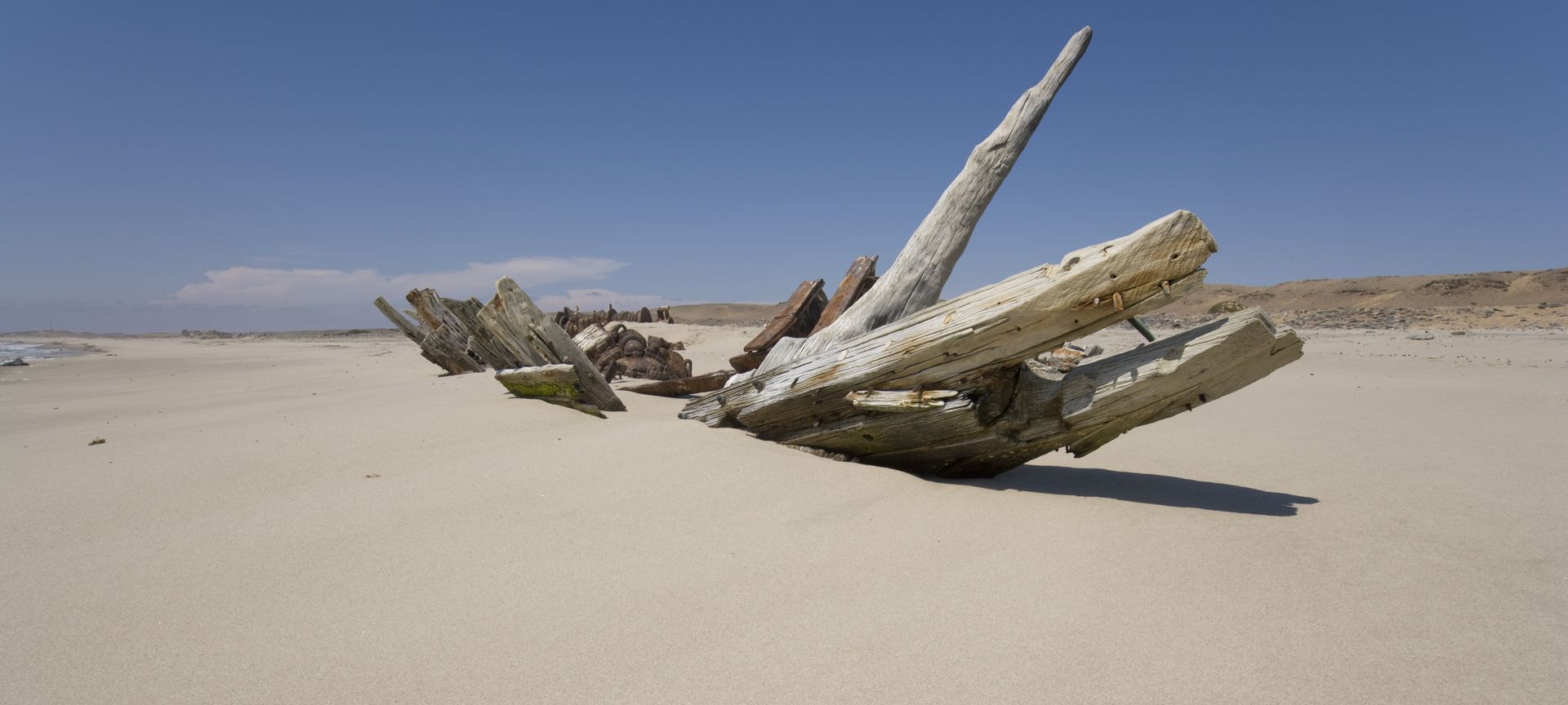 A skeleton of a wrecked ship on the beach in Namibia