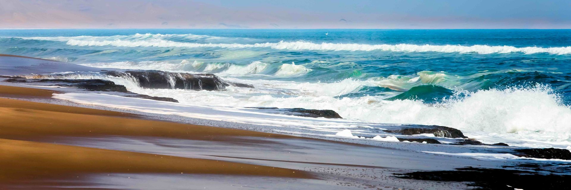 Waves crashing agains the beach along the Skeleton Coast